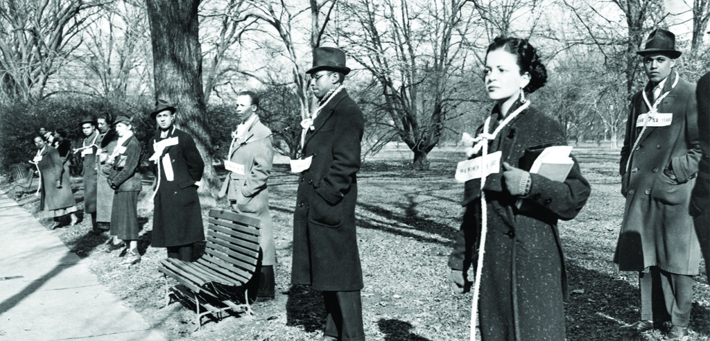 Demonstrators of the NAACP protesting against the terror of lynching and brutal murder of Black lives in America. It includes men and women protesters advocating for laws against lynching. 