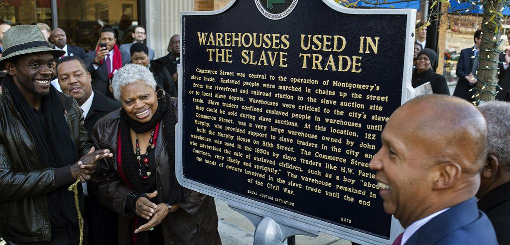 Actor Chris Chalk applauds unveiling of marker about Warehouses Used in the Slave Trade.