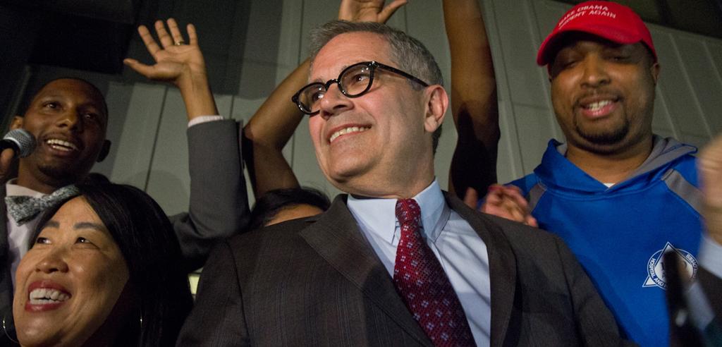 Larry Krasner celebrates Democratic primary win with supporters.